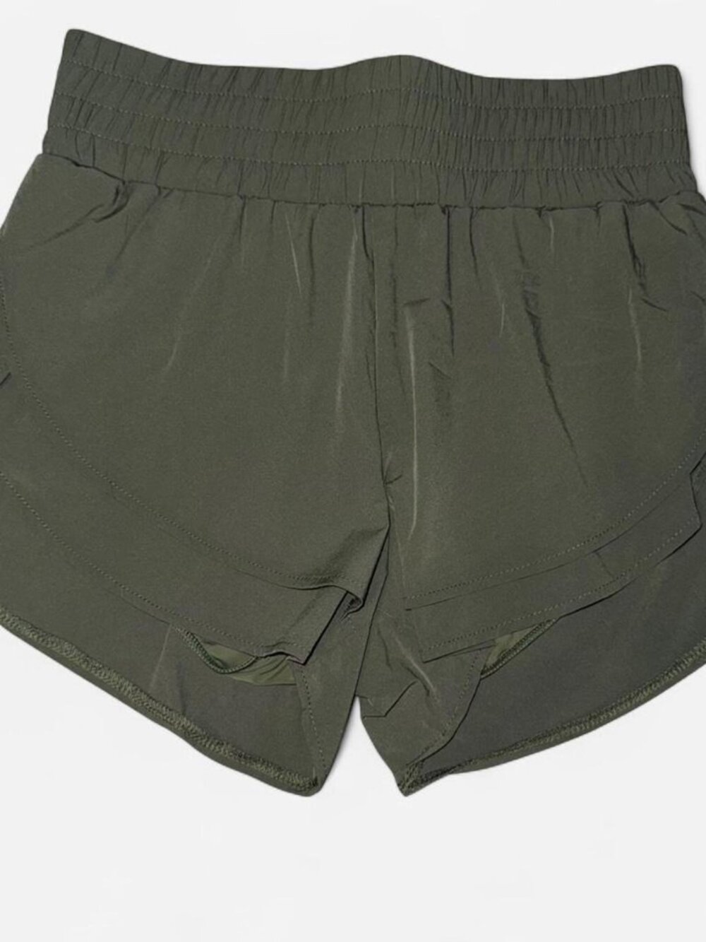 Women Baleaf green running shorts with built in liner and small pocket. Size S.